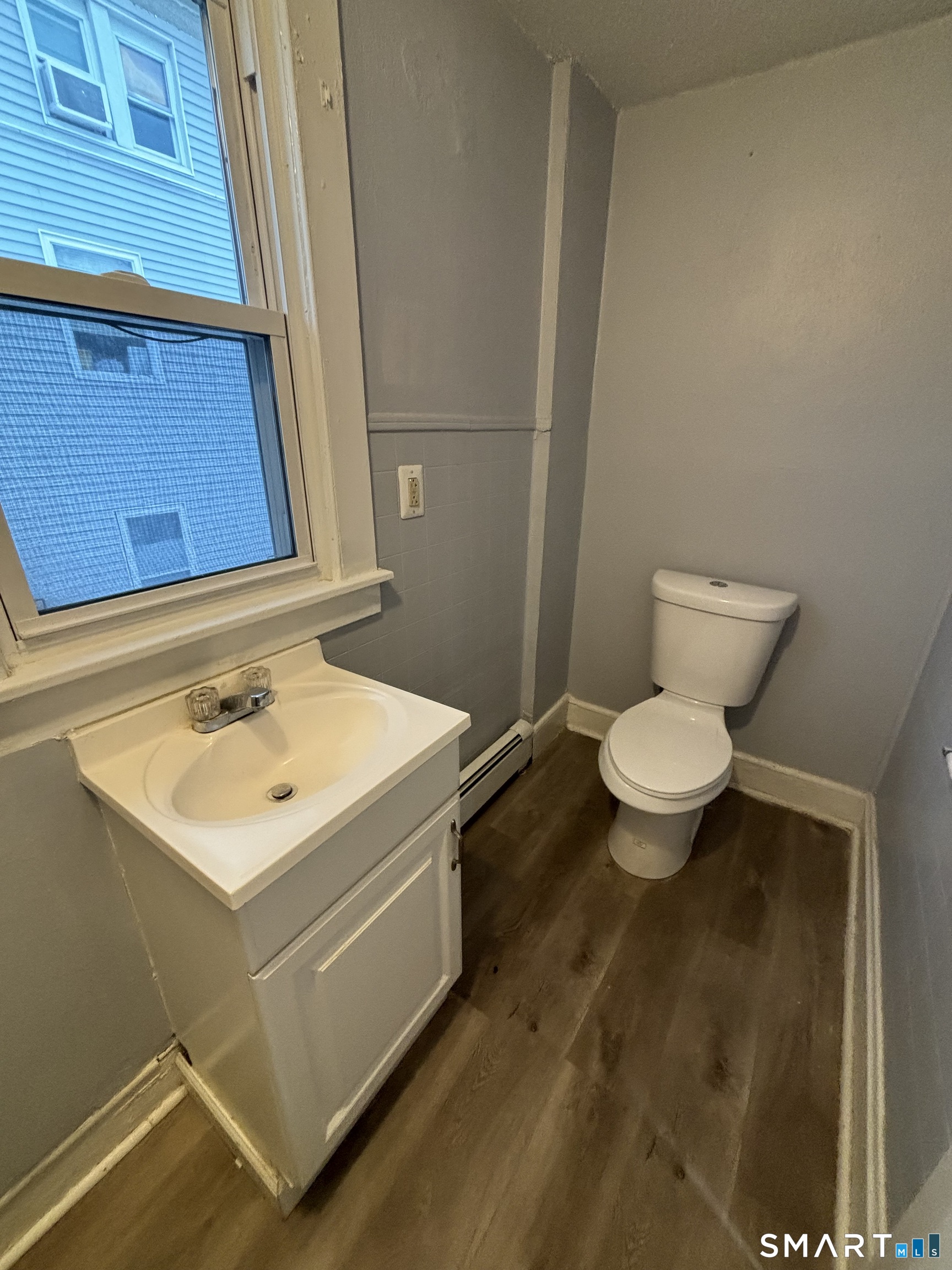 126 Main Street Terryville, CT 06786 - Photo 13 of 14 a bathroom with a sink toilet and a mirror