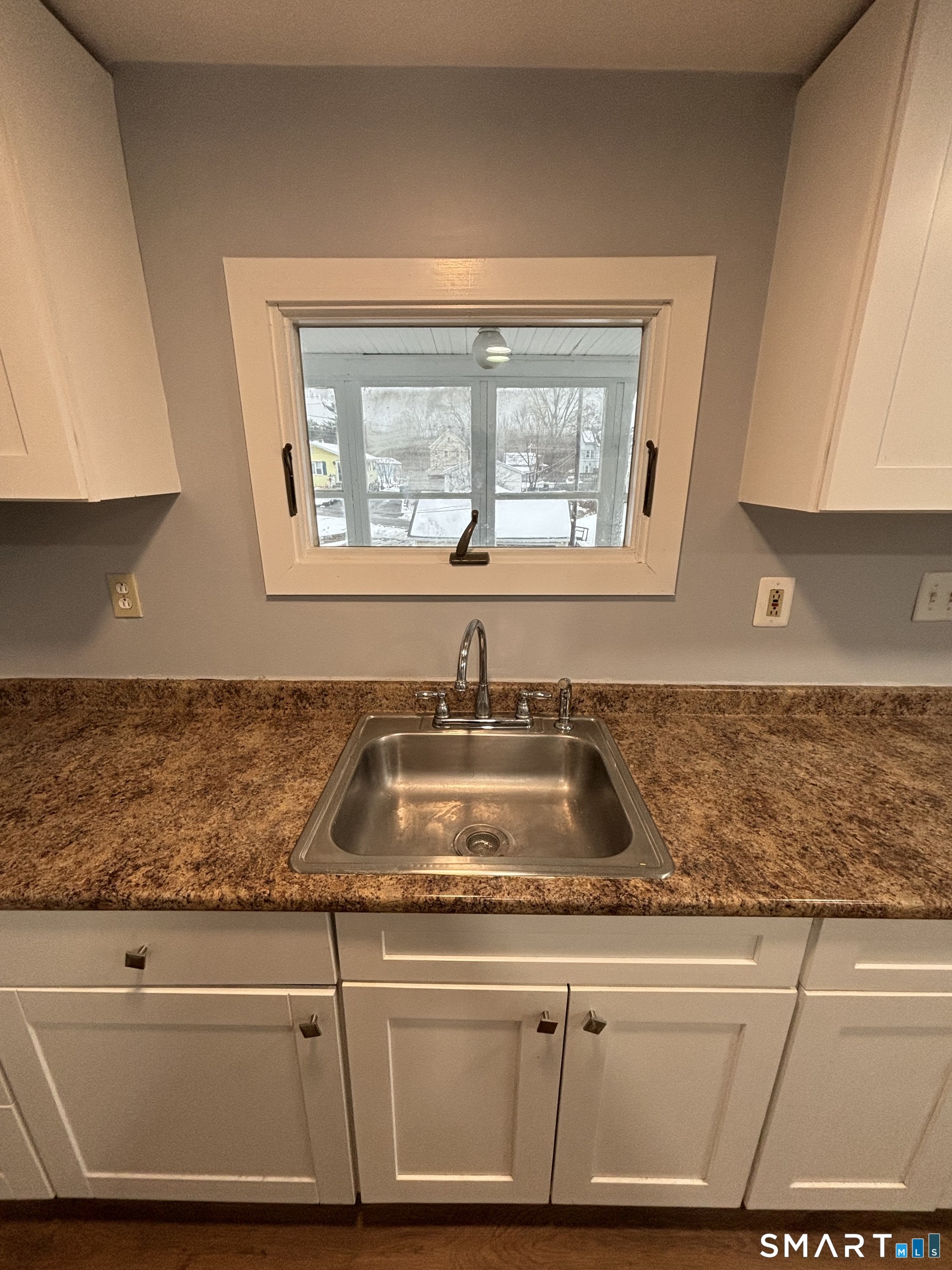 126 Main Street Terryville, CT 06786 - Photo 4 of 14 a kitchen with granite countertop a sink and a window