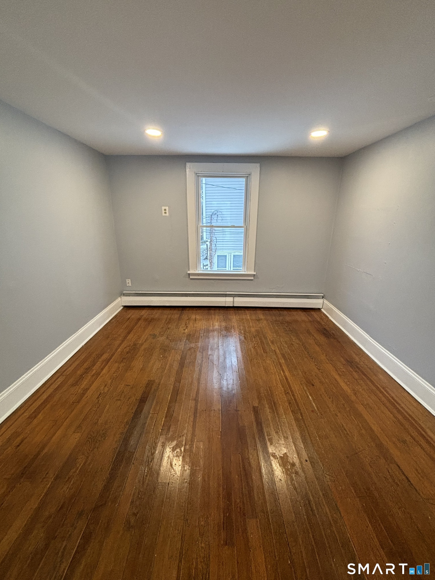 126 Main Street Terryville, CT 06786 - Photo 10 of 14 a view of room with wooden floor and window