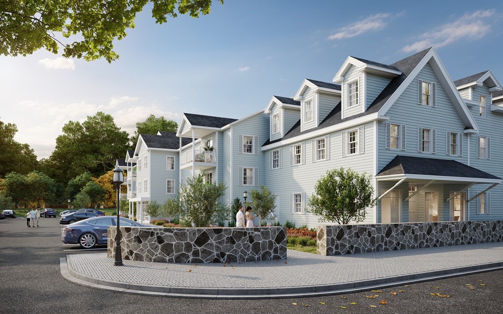 a view of a white house next to a road with large trees