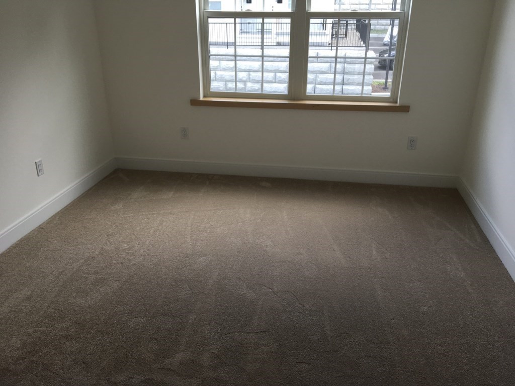 2239 Washington Street, Unit 200 Canton, MA 02021 - Photo 34 of 35 an empty room with a window