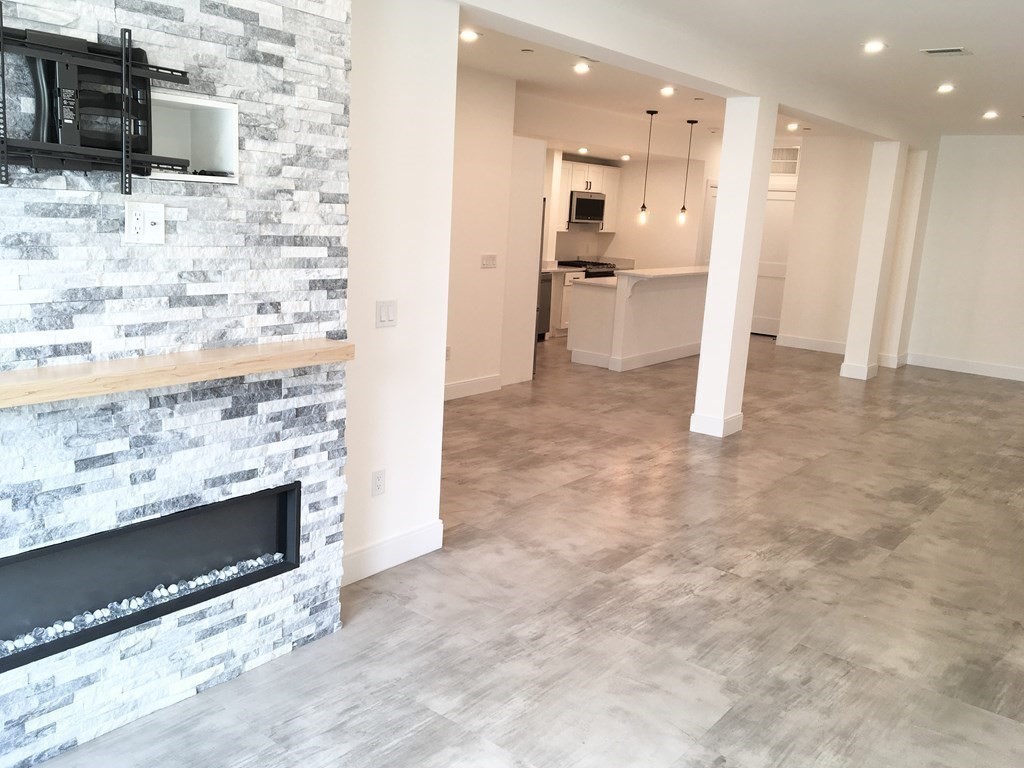 2239 Washington Street, Unit 200 Canton, MA 02021 - Photo 9 of 35 a view of a kitchen cabinets and a kitchen counter top space