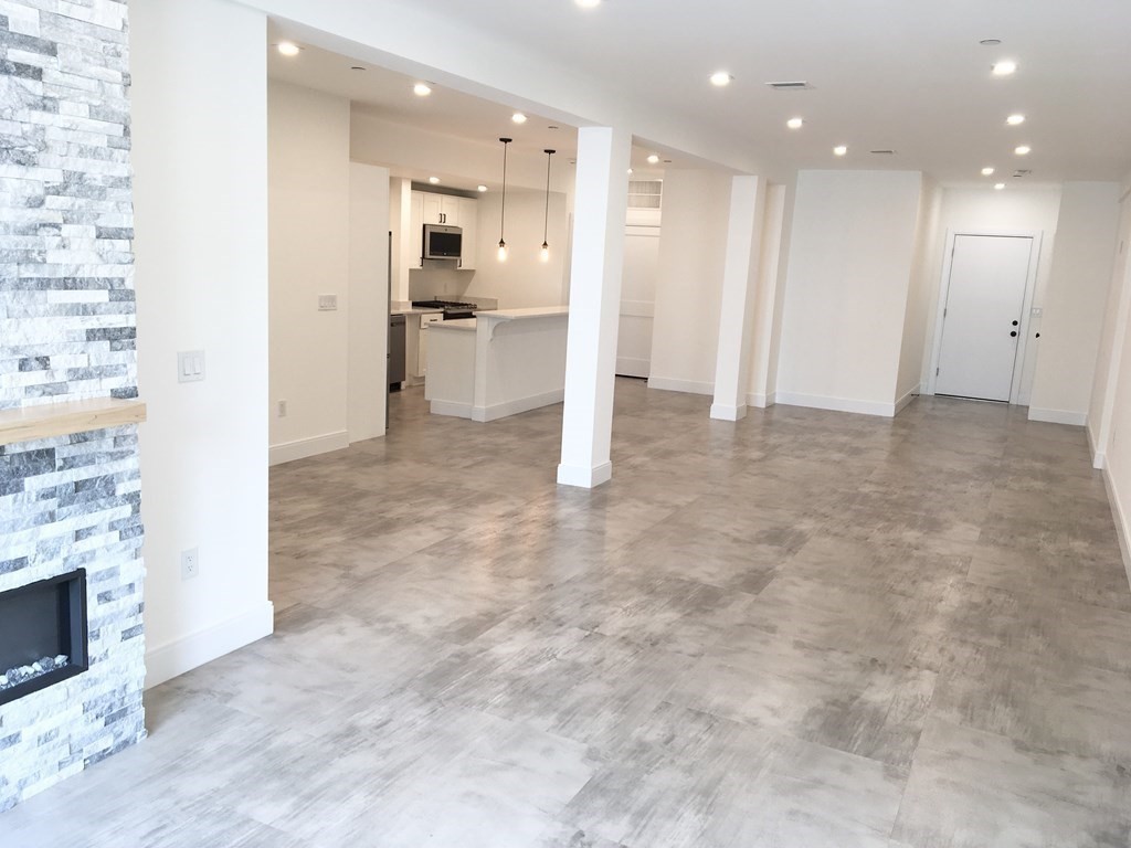 2239 Washington Street, Unit 200 Canton, MA 02021 - Photo 10 of 35 a view of a kitchen with a sink and cabinets