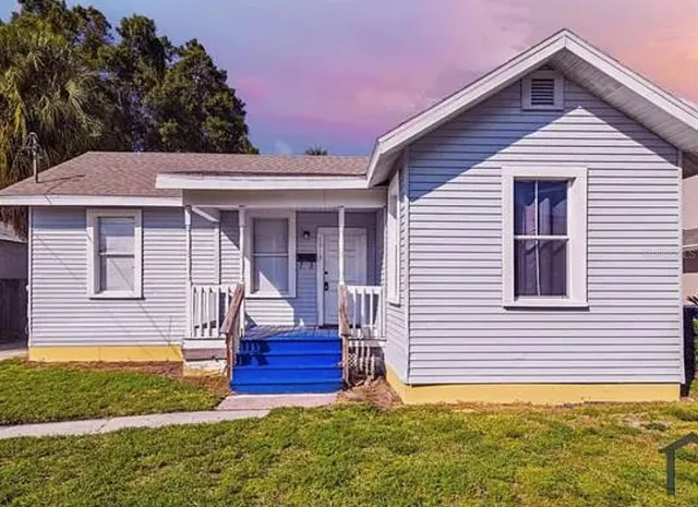 a front view of a house with garden