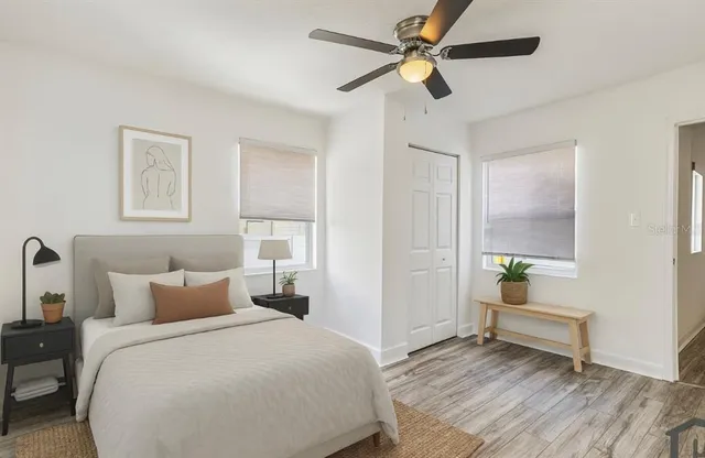 a bedroom with a bed and a window