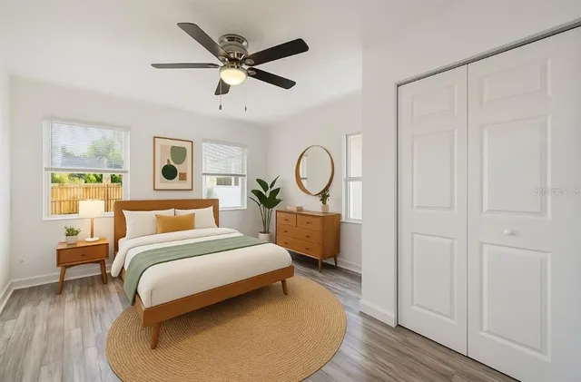 a bedroom with a bed and window