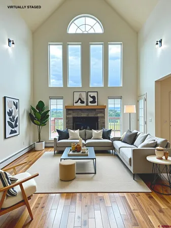 a living room with furniture fireplace and window