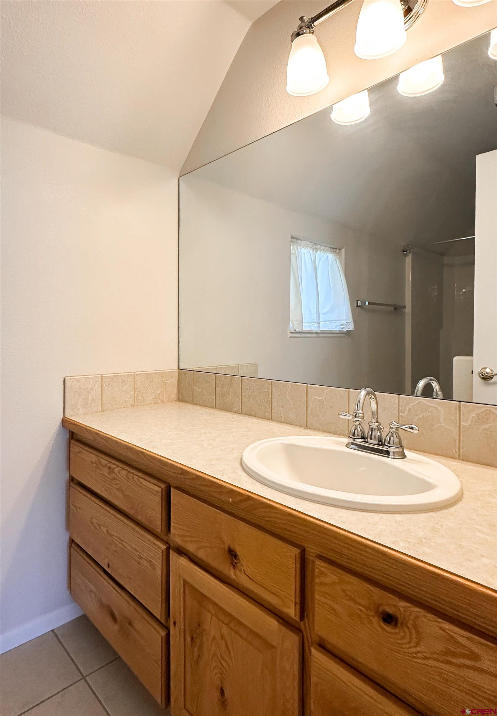 1484 1600th Road Delta, CO 81416 - Photo 31 of 45 a bathroom with a sink and a mirror