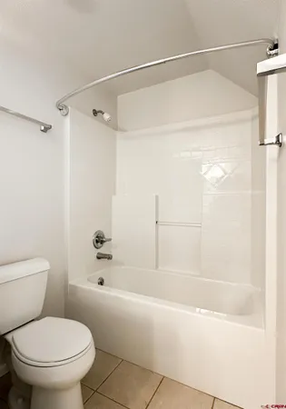 a bedroom with a bed and furniture