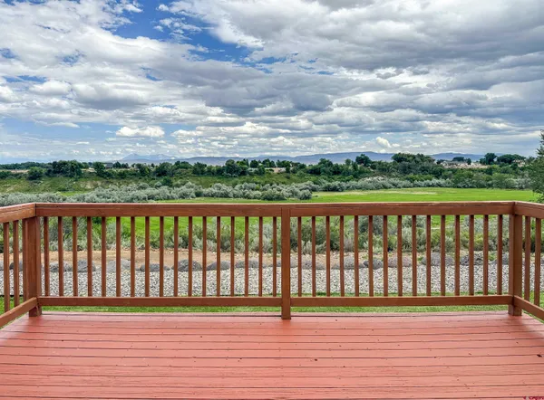 a view of a backyard with sitting area