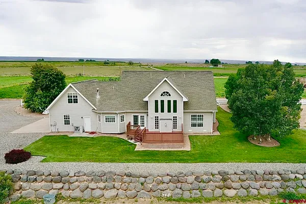 a view of house with garden space and street view