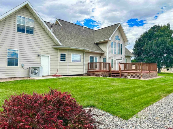 a view of a backyard of the house