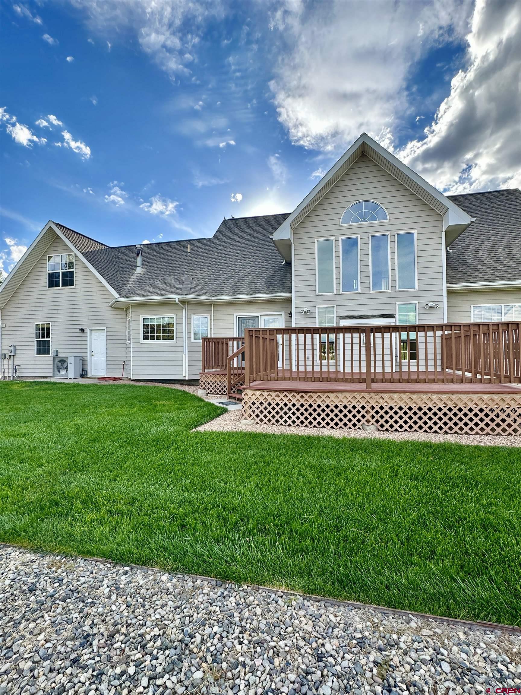 1484 1600th Road Delta, CO 81416 - Photo 5 of 45 a view of a house with a yard and deck