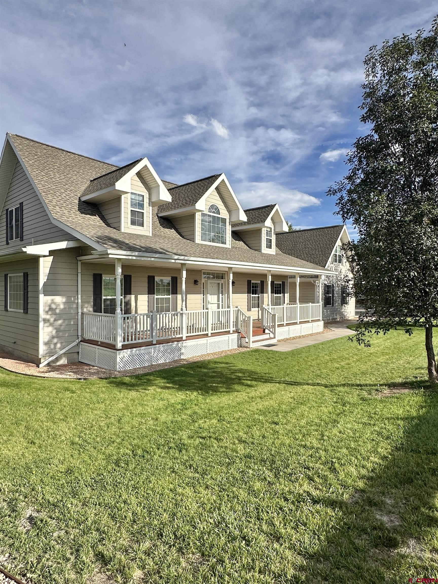 1484 1600th Road Delta, CO 81416 - Photo 8 of 45 a front view of a house with a garden