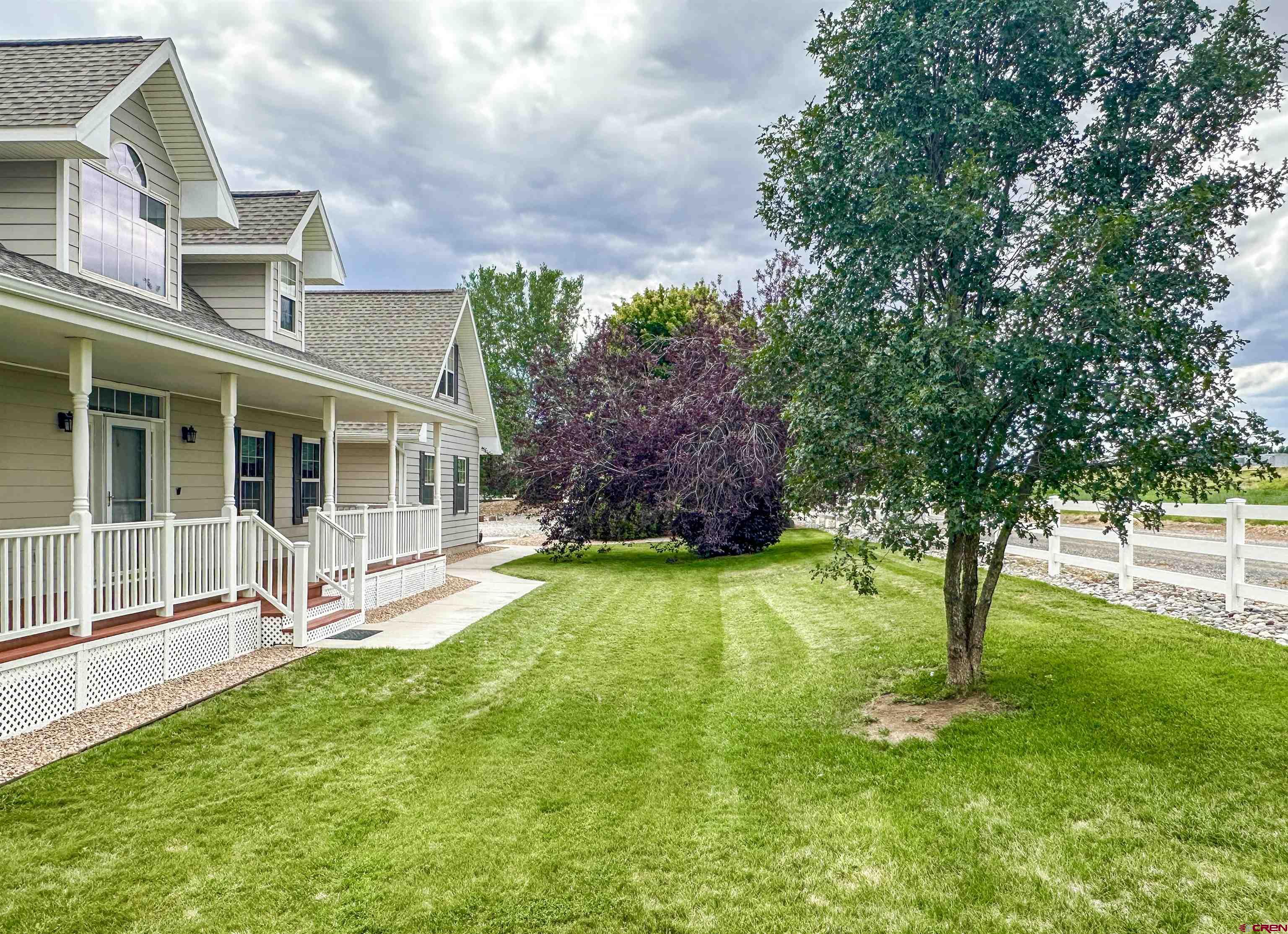 1484 1600th Road Delta, CO 81416 - Photo 9 of 45 a front view of a house with garden