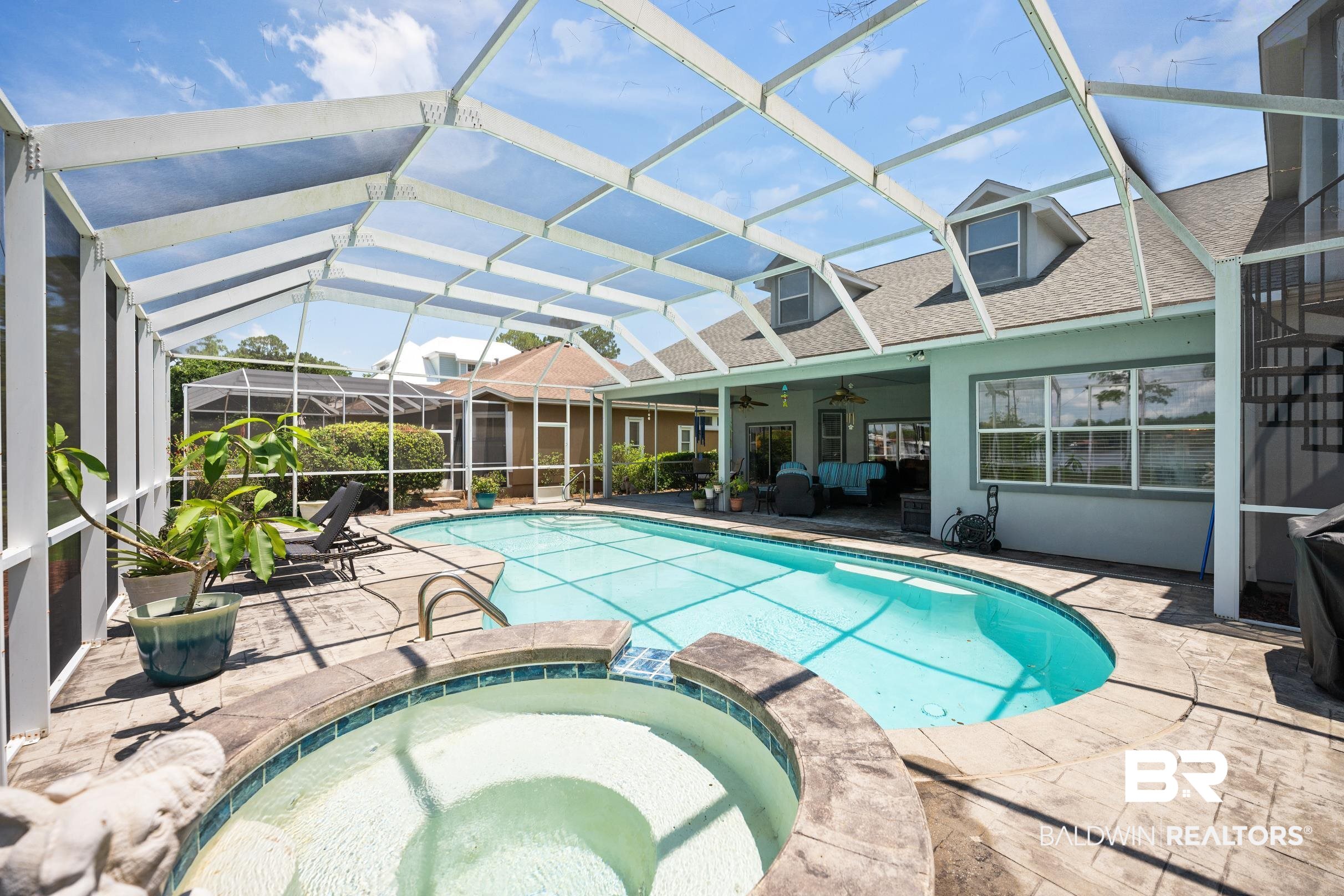8585 Bay Harbor Road Elberta, AL 36530 - Photo 3 of 51 View of swimming pool with ceiling fan, a patio, a pool with connected hot tub, and a lanai