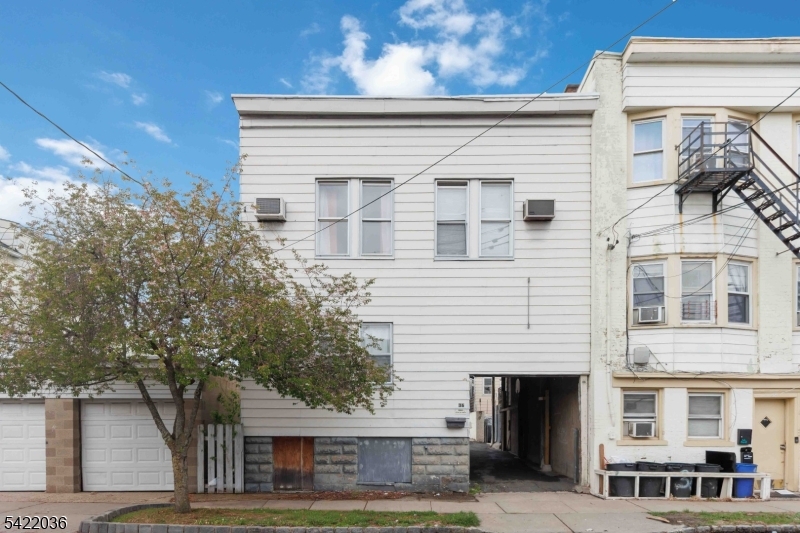 36 Edison Street Bloomfield, NJ 07003 - Photo 22 of 28 a view of a white building among the street