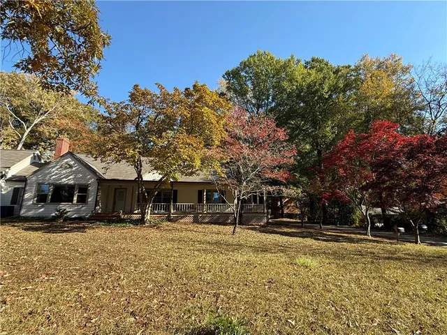 a swimming pool view with a outdoor seating