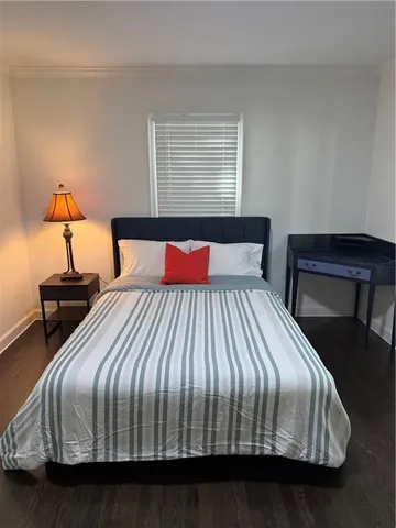 a bedroom with a bed and window