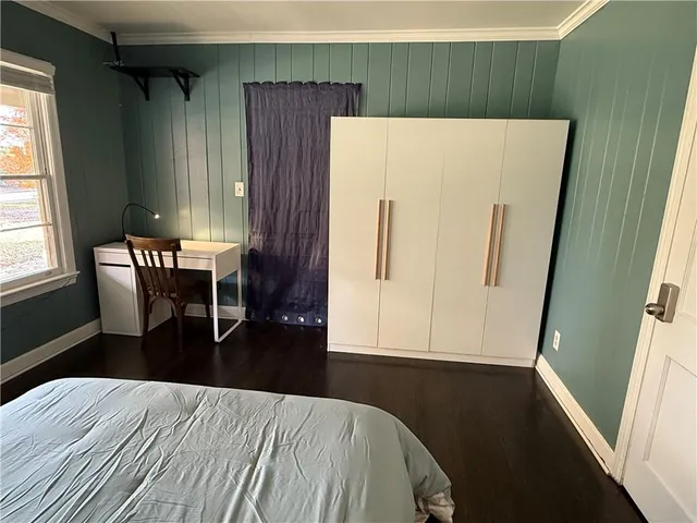 a view of kitchen and dining room with wooden floor