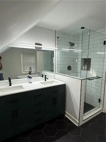 a bathroom with a double vanity sink mirror and double