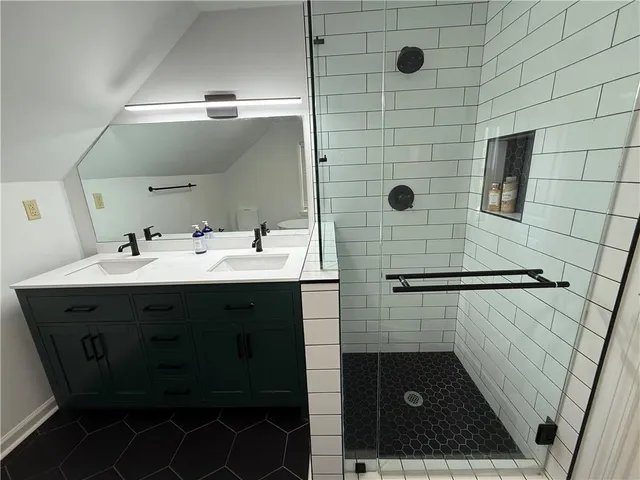 a bathroom with a sink and mirror
