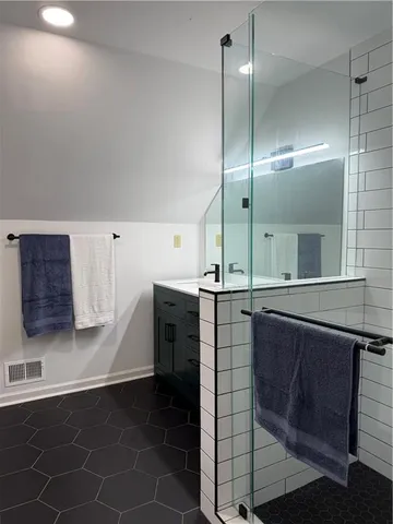 a kitchen with stainless steel appliances a sink stove and cabinets