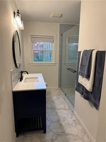 a bathroom with a sink and a mirror