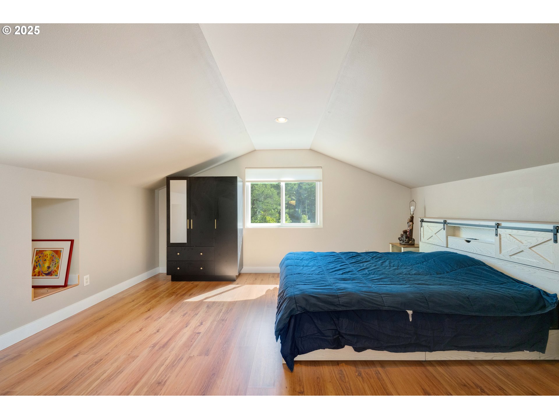 55654 Prosper Jct Road Bandon, OR 97411 - Photo 32 of 48 a bedroom with a bed and a window