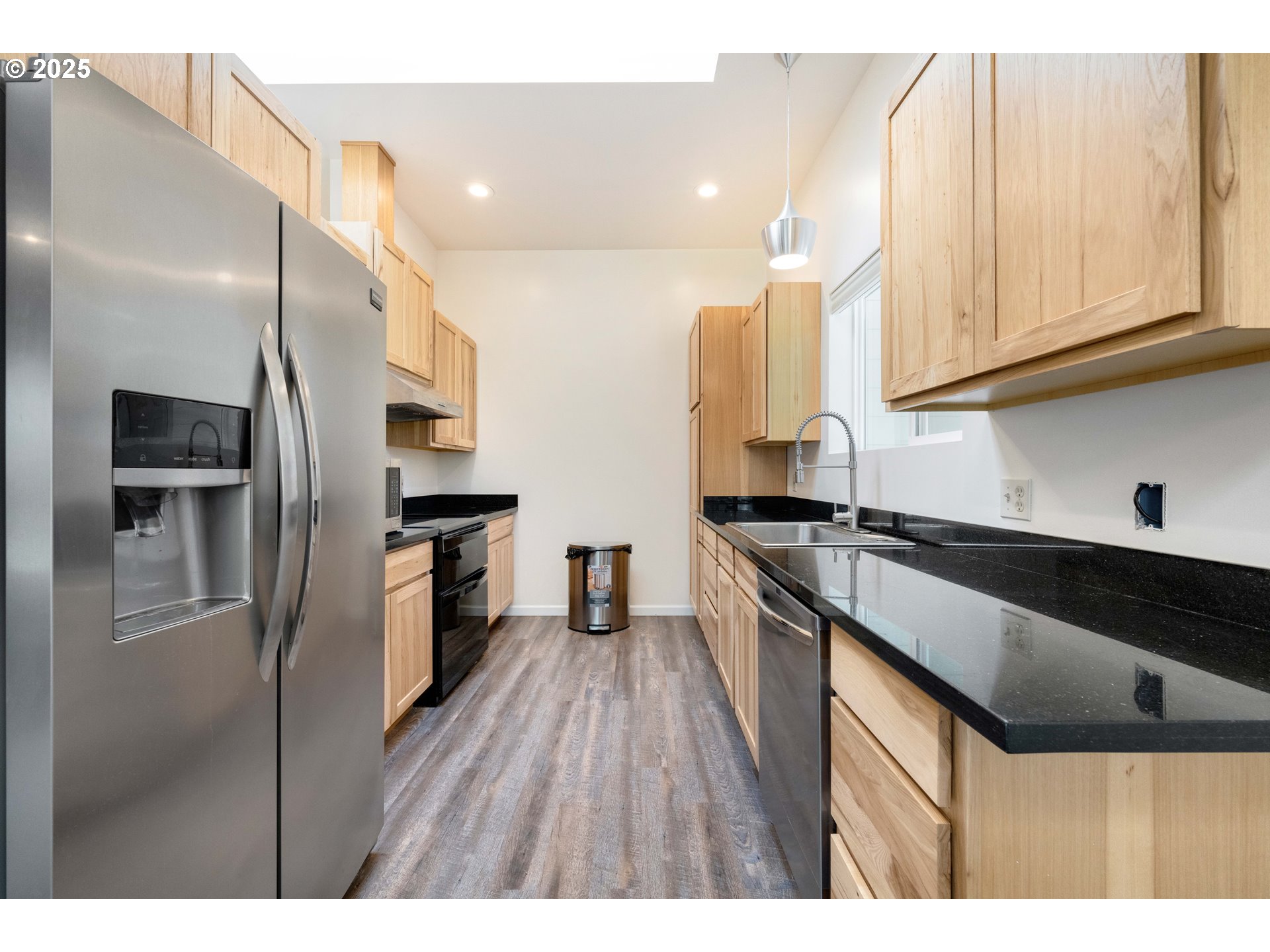 55654 Prosper Jct Road Bandon, OR 97411 - Photo 39 of 48 a kitchen with granite countertop a refrigerator stove and sink