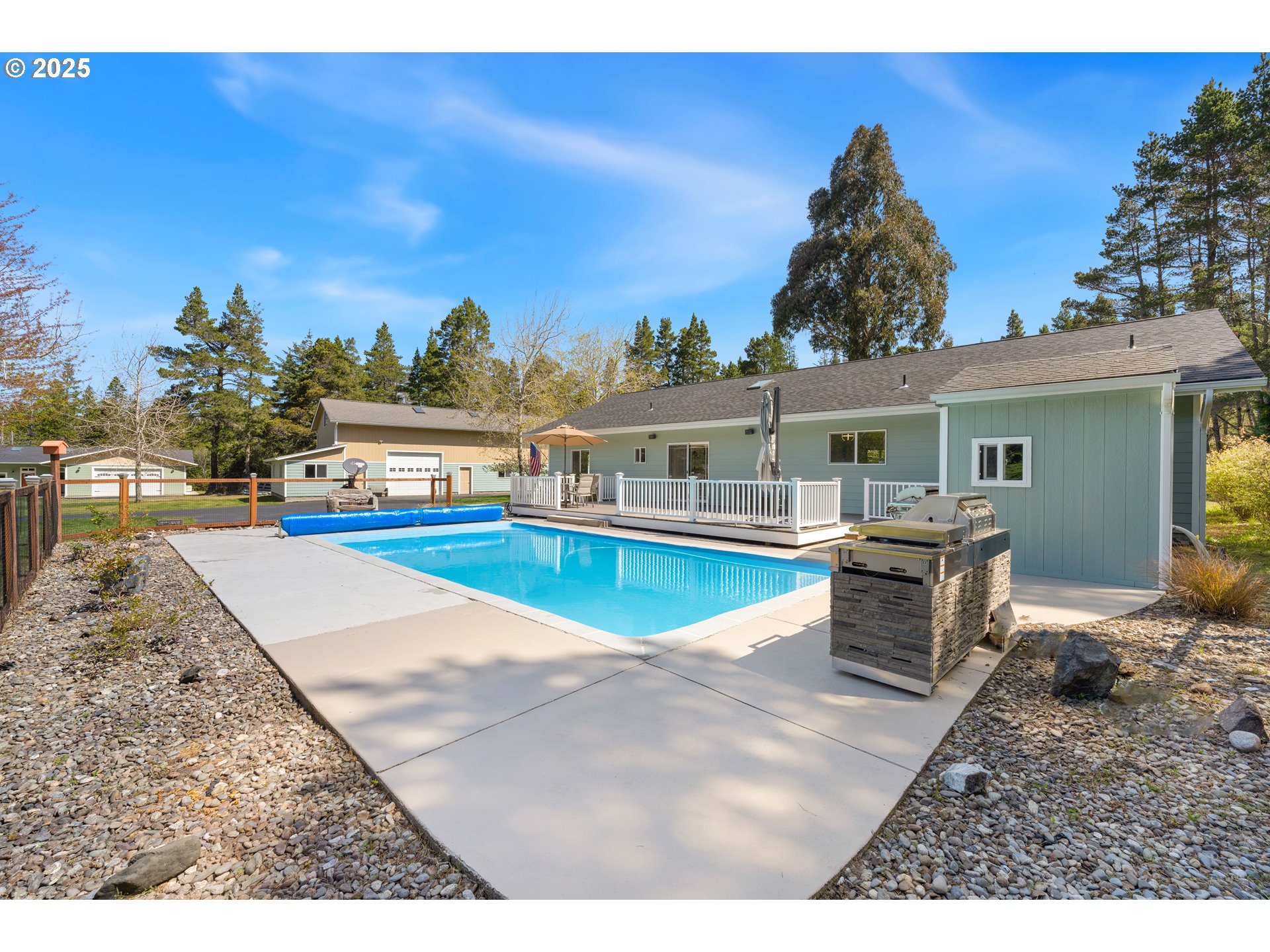 55654 Prosper Jct Road Bandon, OR 97411 - Photo 4 of 48 a view of a house with swimming pool