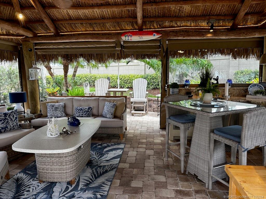 a outdoor dining space with furniture and outdoor view
