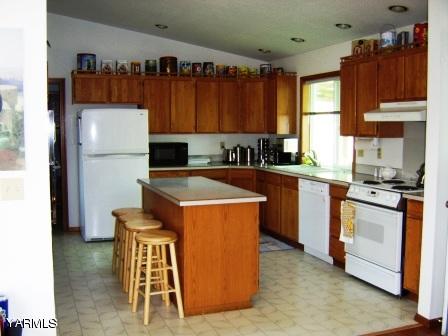 910 Thompson Road Cowiche, WA 98923 - Photo 3 of 28 a kitchen with sink cabinets and appliances