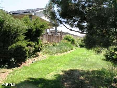 910 Thompson Road Cowiche, WA 98923 - Photo 22 of 28 a view of a garden with a tree