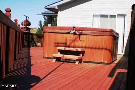 910 Thompson Road Cowiche, WA 98923 - Photo 23 of 28 a backyard of a house with wooden floor outdoor seating and outdoor seating