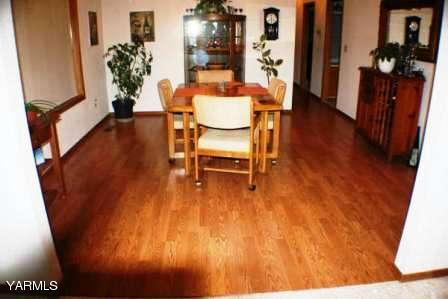 910 Thompson Road Cowiche, WA 98923 - Photo 7 of 28 a dining room with furniture and wooden floor