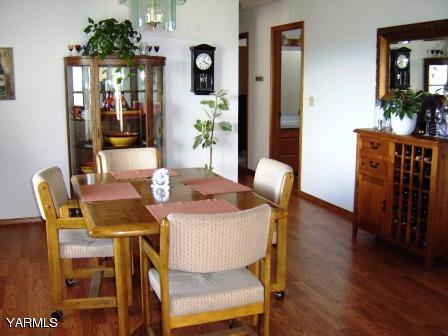 910 Thompson Road Cowiche, WA 98923 - Photo 8 of 28 a dining room with furniture and wooden floor