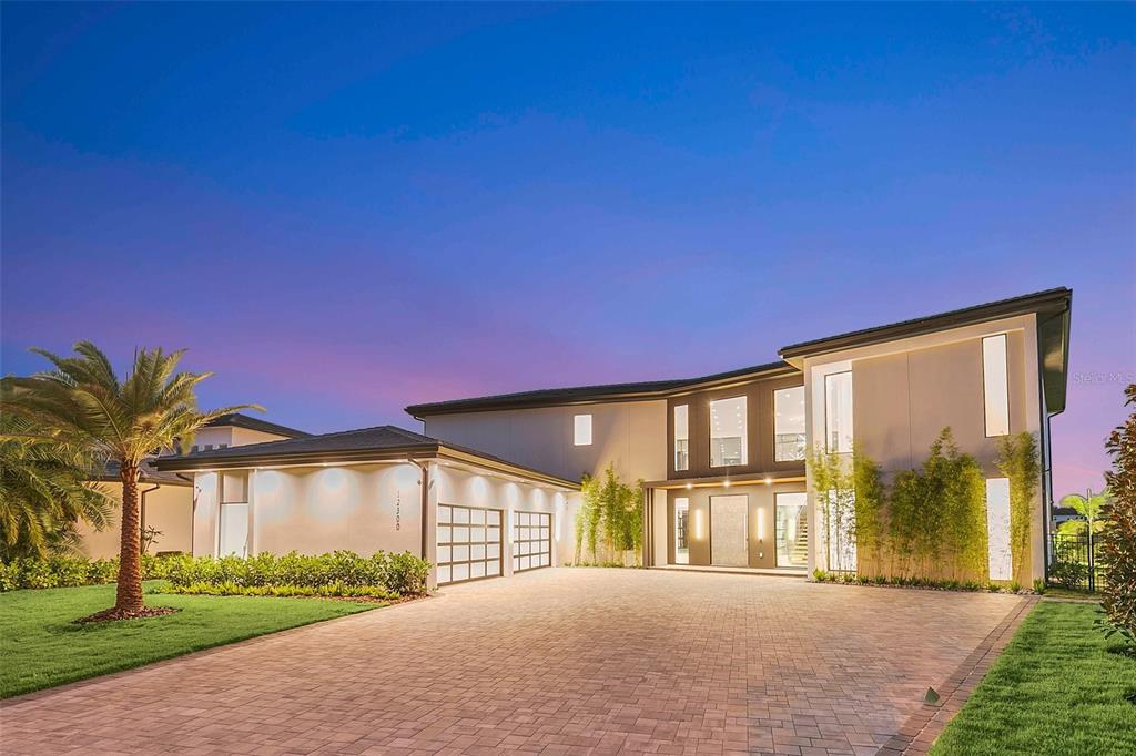 Welcome to newly built lake front home at 12300 Montalcino Cir Windermere, FL 34786