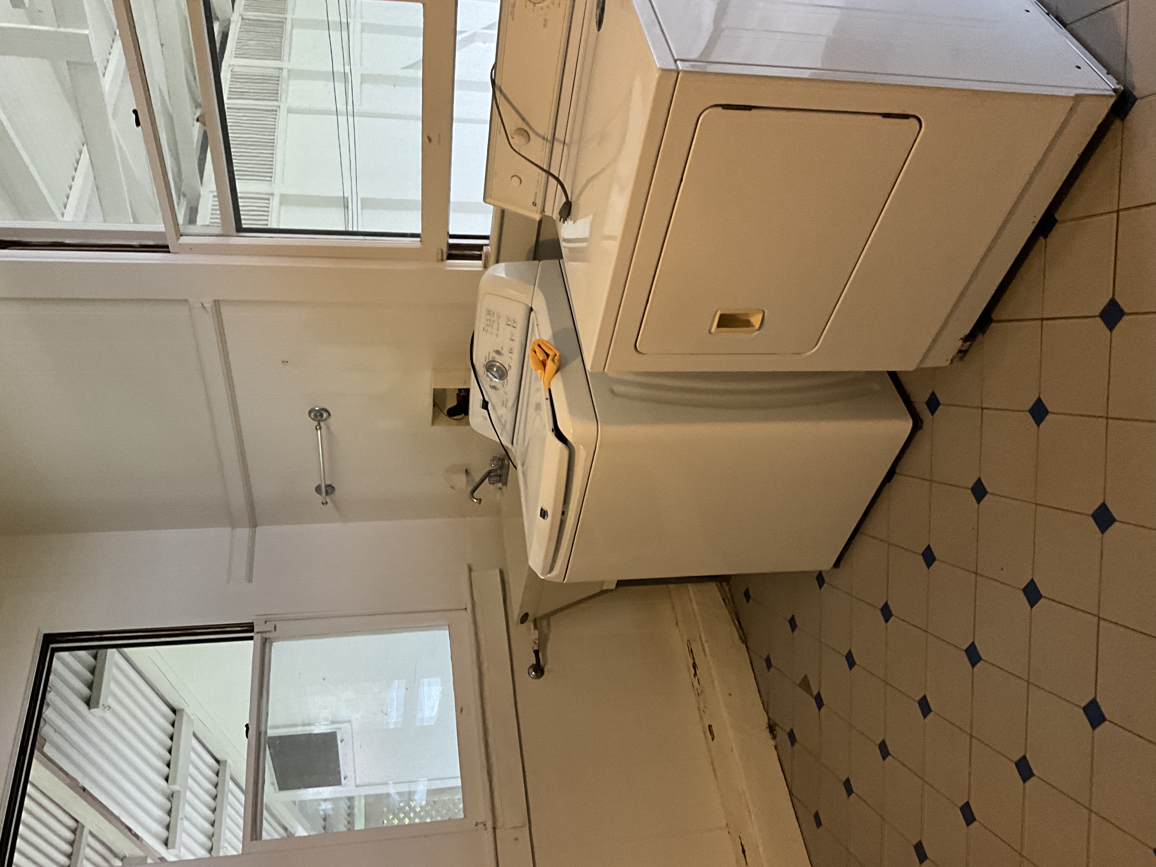 568 Kalanikoa Street, Unit 2 Hilo, HI 96720 - Photo 13 of 24 a utility room with dryer and washer