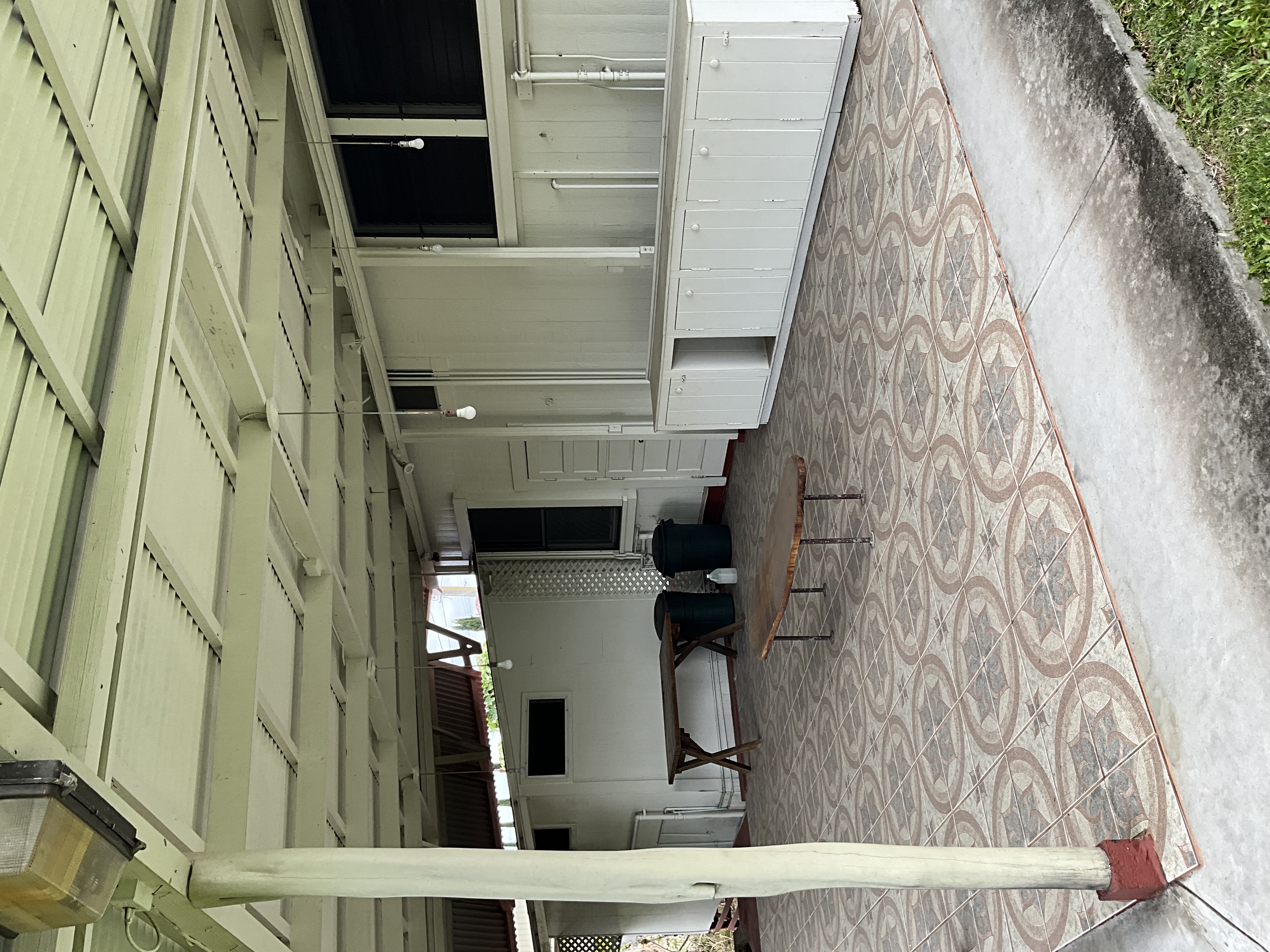 568 Kalanikoa Street, Unit 2 Hilo, HI 96720 - Photo 14 of 24 a view of a patio with table and chairs