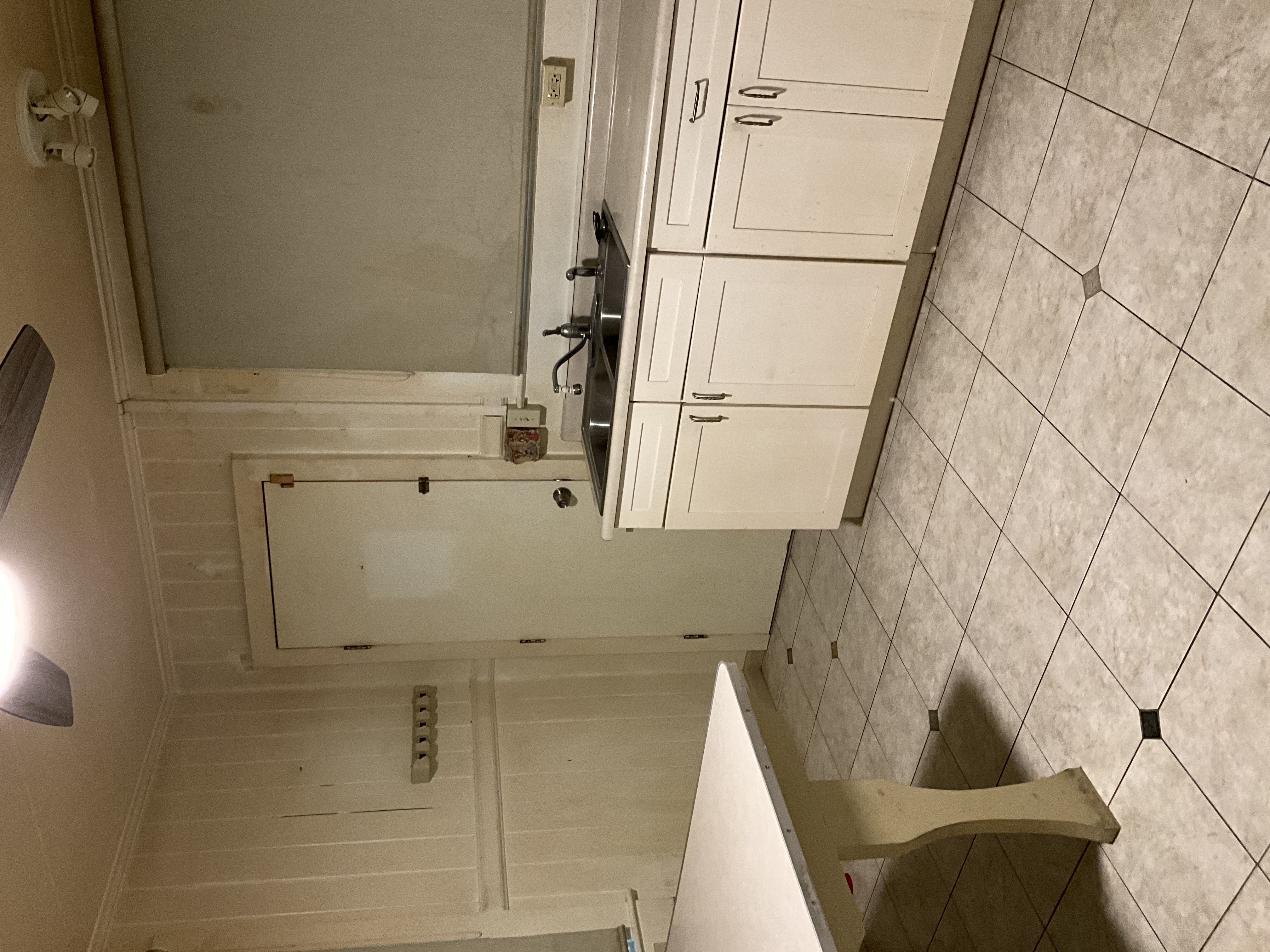 568 Kalanikoa Street, Unit 2 Hilo, HI 96720 - Photo 19 of 24 a kitchen with a sink and cabinets