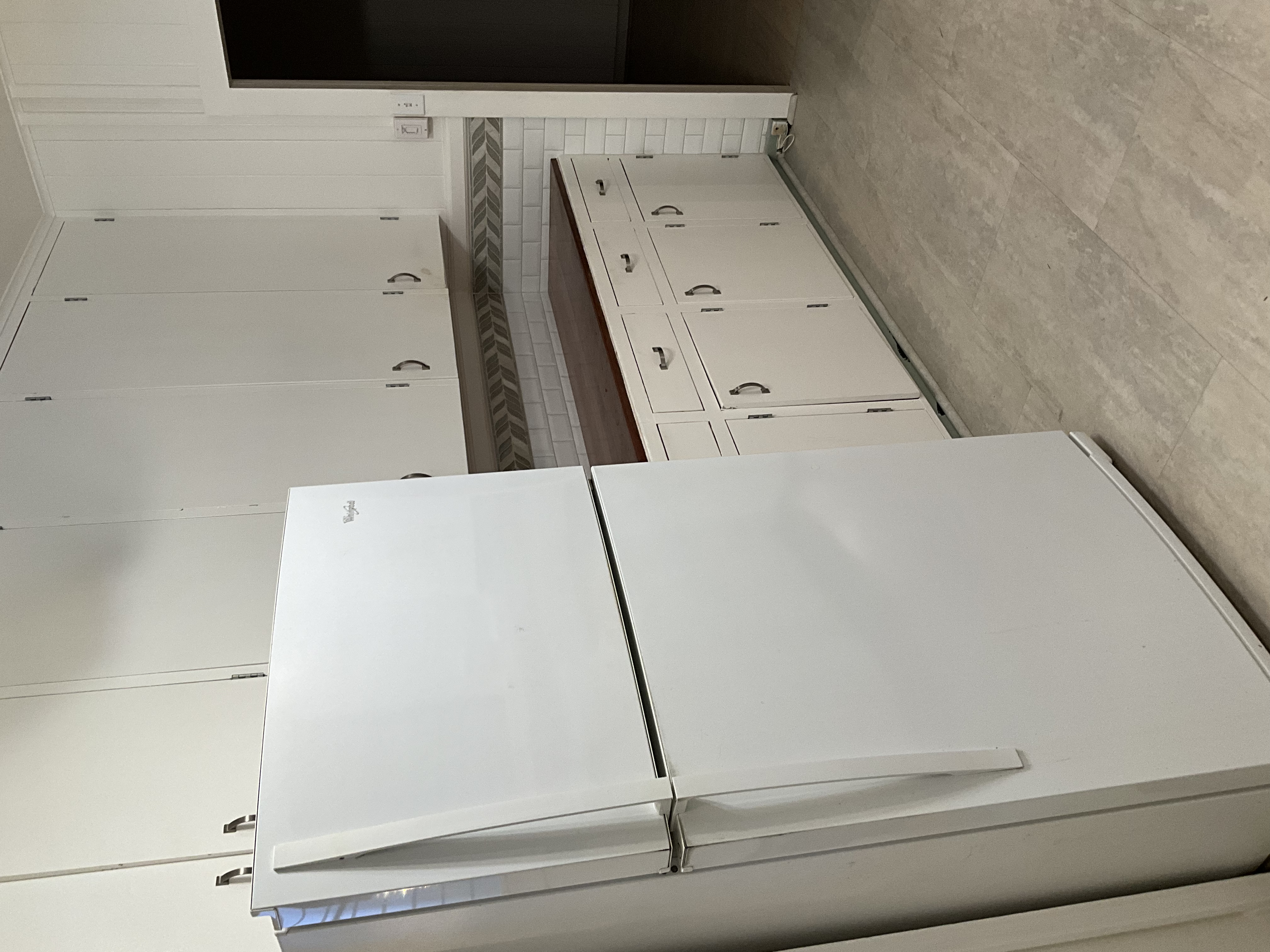 568 Kalanikoa Street, Unit 2 Hilo, HI 96720 - Photo 5 of 24 a white refrigerator freezer sitting in a kitchen