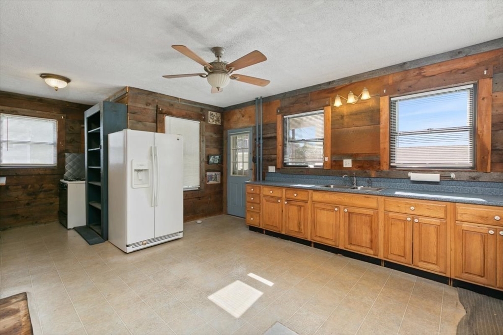 98 Webster Street Haverhill, MA 01830 - Photo 14 of 42 a large kitchen with a large window and refrigerator