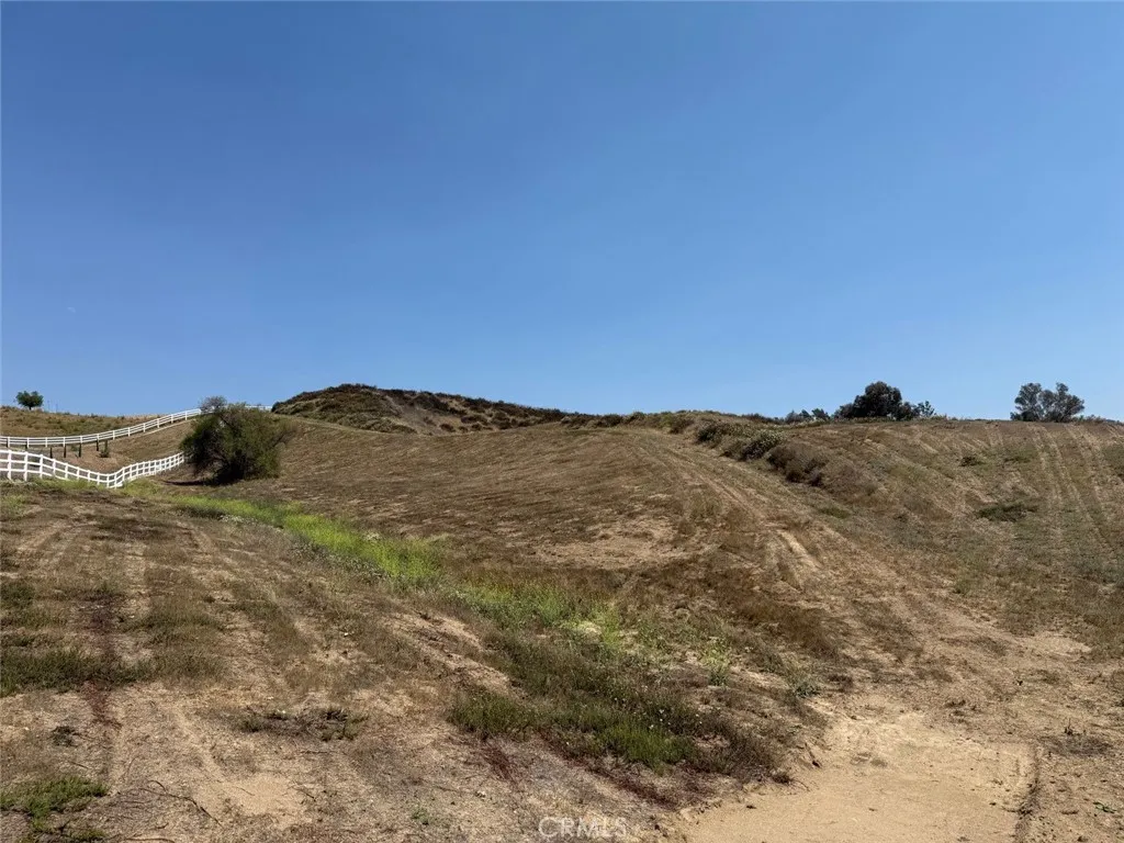 0 Paulita Road Temecula, CA 92592 - Photo 33 of 36 a view of a large building with mountains in the background