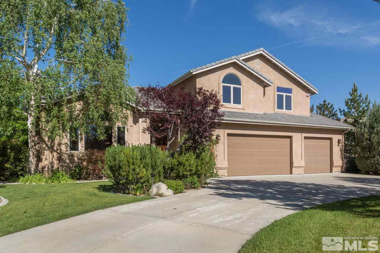 741 Aspen Trail Reno, NV 89519 - Photo 1 of 1 a view of front of house with a yard and garage