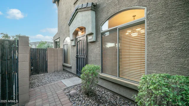 a view of a bird house next to a yard