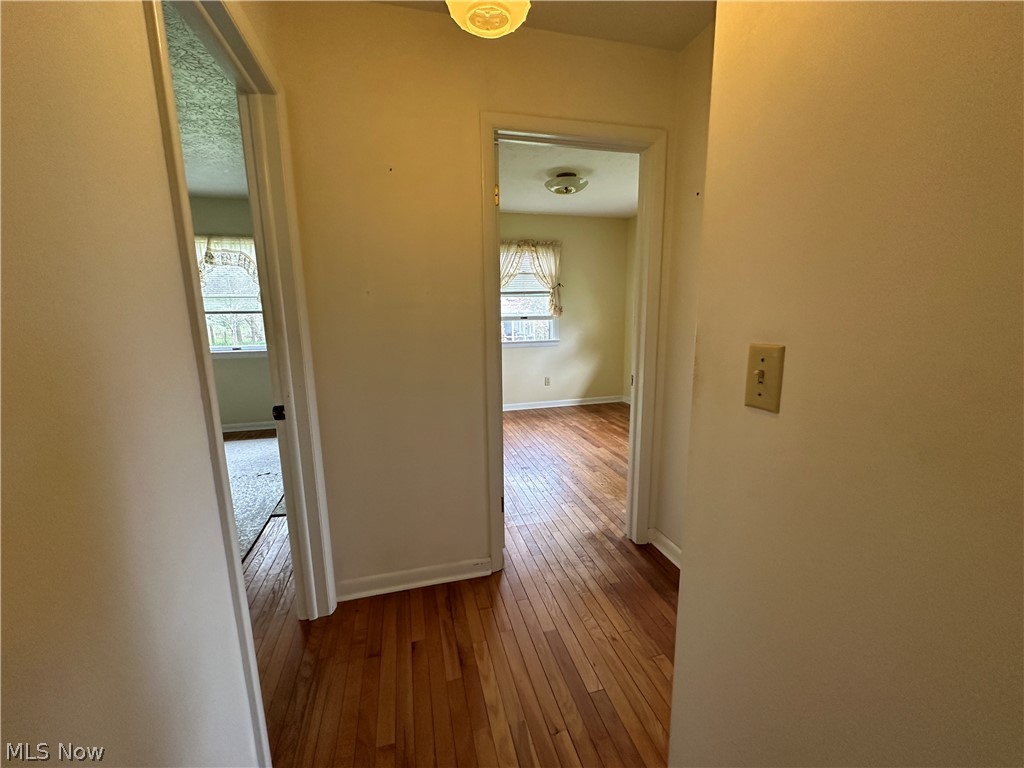 2408 Brown Road Ashtabula, OH 44004 - Photo 11 of 27 Hall with hardwood / wood-style floors