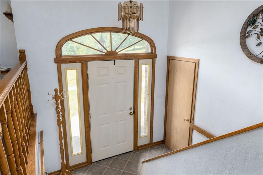 Spacious entry with ceramic tile flooring.
