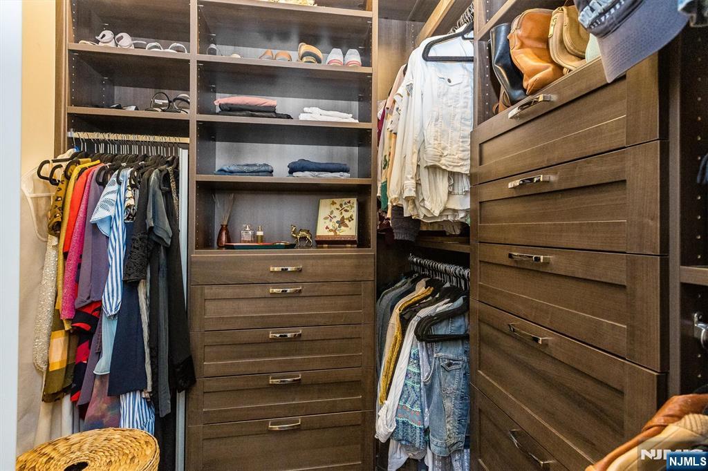 25 Clark Street, Unit 205 Glen Ridge, NJ 07028 - Photo 14 of 28 a view of walk in closet with clothes and shoes