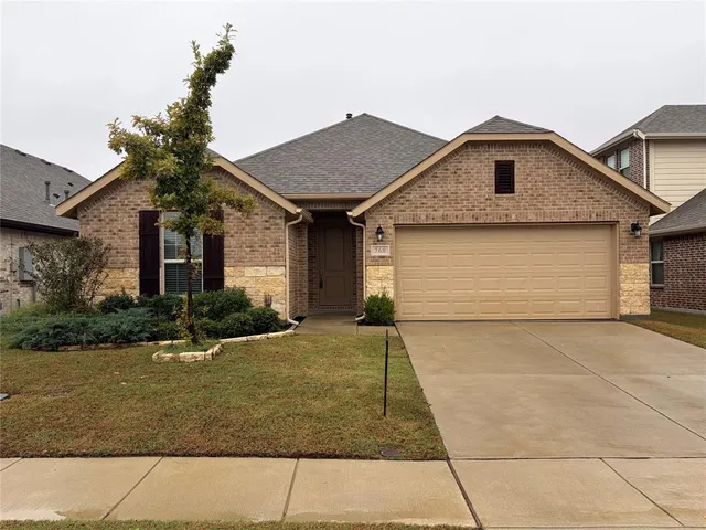 a front view of a house with yard
